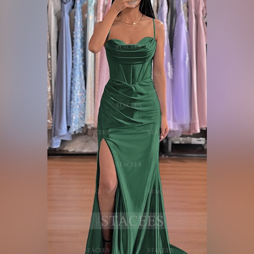 A beautiful emerald green dress that has never been worn.
